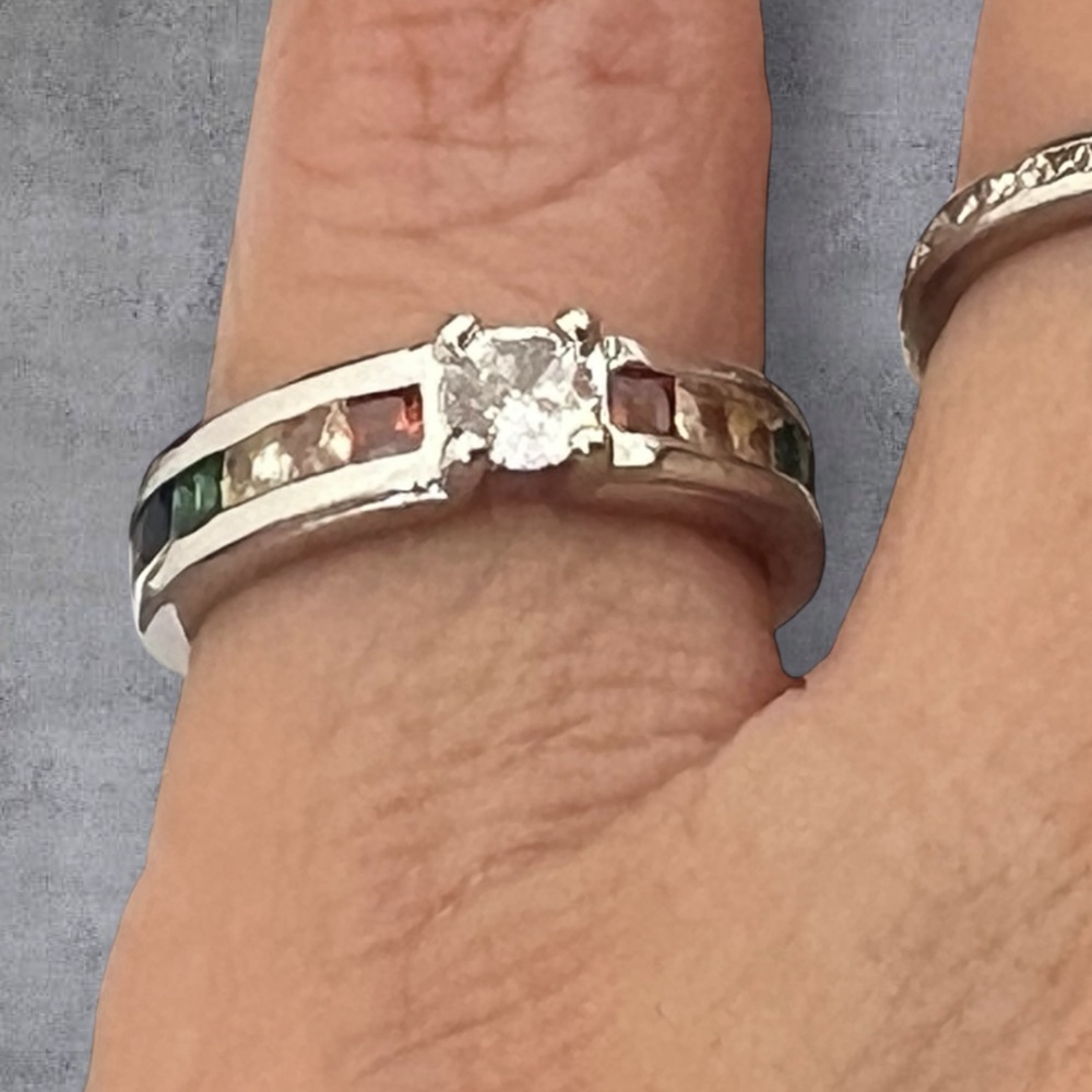 Silver .925 solitaire ring with multi color CZ on each size, stamped